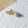 Ciondoli distanziatori fiocco in zircone dorato e argentato per bracciali e collane - Fiocco Strass Bicolore (5952432664386)