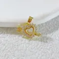 Close-up detail of a gold plated heart arrow pendant sparkling with mini cubic zirconia stones. - Gold Heart with Arrow Rhinestone (4)