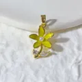 Detail shot of yellow enamel flower pendant featuring pearl center and sparkling zirconia stones. - Yellow Five-Petal Flower (1)