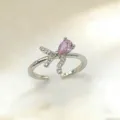 Eleganter Damen Kupfer vergoldet Schleife Tropfen lila Zirkonia offener Ring Hauptansicht - Schleife Wassertropfen Violetter Zirkonia (3) / Gold