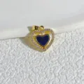 Gold plated copper heart pendant detail view with sparkling micro zircon stones and blue inlay. - Black Rotating Double Layer Heart