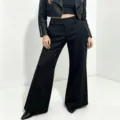 Detail view of women's black high-waist wide-leg trousers, tailored suit pants for daily wear. - S / Bottoms / Black