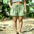 Detailed view of women's summer casual waffle shorts with elastic drawstring and side pockets. - Matcha Green