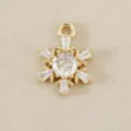 Exquisite gold snowflake pendant charm with sparkling cubic zirconia, perfect for DIY jewelry. - Gold