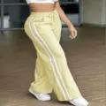 Light yellow wide-leg sweatpants with white side stripes, casual drawstring track pants for women. - XS / Bottoms / Yellow