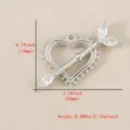 Close-up detail of silver heart arrow pendant with sparkling cubic zirconia stones for DIY. - Silver