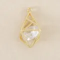 Detailed close-up shot of gold plated geometric hollow cage pendant with clear crystal inside - Gold