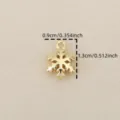 Gold snowflake pendant detail close up view, diy jewelry accessory, small cute charm. - Gold