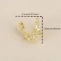 Close-up detail of 18k gold plated bow flower pendant, sparkling zircon inlay DIY jewelry charm. - Gold