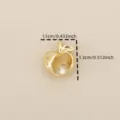 Close-up of 18k gold plated copper hollow apple pendant with sparkling zircon detail. - Gold