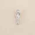 Close up of a silver spoon charm pendant with engraved letter detail, perfect for DIY jewelry. - Silver