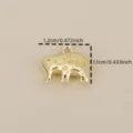 Close-up detail of the gold-plated elephant pendant charm with delicate engraved texture patterns. - Gold