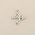 Detailed shot of bow and arrow charm pendant jewelry accessory silver tone metal. - Silver