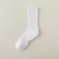 White athletic crew socks for men with grip soles, comfortable cotton fabric for sports and daily wear. - Long Socks / White
