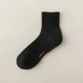 Black athletic crew socks with breathable mesh and anti-slip sole for men daily sports. - Crew Socks / Black