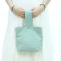 Minimalistische einfarbige Segeltuch Handtasche, lässige Handgelenktasche für Damen im Alltag. - Bohnengrün