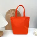 Orangene Segeltuch Tragetasche, einfarbige Lunchtasche, kleine modische Handtasche. - Orangerot