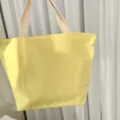 Yellow canvas lunch bag for women, portable cotton tote bag for office workers and daily use. - Light Yellow