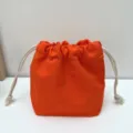 Einfarbiger Kordelzugbeutel aus Canvas, tragbare Make-up-Tasche, lässiger staubdichter Alltagsorganizer. - Orangerot