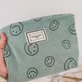 Kordfutteral Kosmetiktasche mit Smiley, süße tragbare Reißverschlusstasche für Damen. - Grüner Cord Smiley