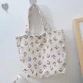 Corduroy tote bag featuring purple tulip floral pattern, ideal for daily commuting and school use. - Purple Small Flowers