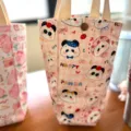 Rosa Segeltuch Tassenbeutel mit süßem Panda-Muster, tragbare Handtasche für Wasserflasche. - Rosa Panda / 26x12cm
