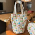 Jede süße Cartoon Kordelzug Leinentasche ist eine tragbare Handtasche für tägliche Pendler. - Gitterbasis Kleines Mädchen