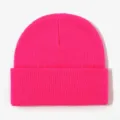 Bright pink knitted beanie close-up, warm winter cuffed hat detail view, soft cozy fabric. - Rose Red