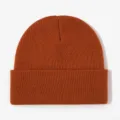 Orange knit beanie detail view, warm autumn and winter pullover hat for casual outdoor wear. - Caramel Orange