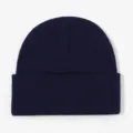 Detailed close-up of a classic navy blue knitted beanie hat showing fine texture. - Navy Blue