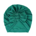 Detailed close-up view of dark green baby turban hat featuring cute triple knot bow design. - One Size / Dark Green