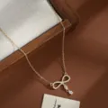 Exquisite gold-plated micro-paved zircon bow necklace detail, elegant and versatile accessory. - Bowknot Style (XL80914) / Gold