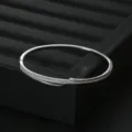 Elegant silver-toned pave cubic zirconia hinged bangle bracelet for women daily commute style. - Silver