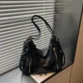 Casual black leather shoulder bag with spacious capacity, chic zipper details and small pouch. - Black