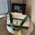 Borsa a tracolla casual in tela con grande capacità e tasche multiple per viaggi e sport. - Bianco