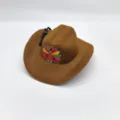 Close up detail showing brown felt Thanksgiving turkey cowboy hat with cute holiday patch. - Brown / 16cm