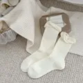 Cream white knit slouch socks for women, featuring elegant lace and delicate pearl decor. - One Size / Milky White