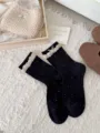 Japanese sweet black polka dot mid tube socks with bubble lace and cute bow for women - One Size / Black