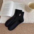 Classic black mid-tube cotton socks featuring a cute embroidered rabbit detail for daily wear. - Women's 35-39 / Black Rabbit