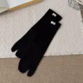 Black split-toe tabi socks with cute white woven label, comfortable cotton geta socks for daily wear. - Black