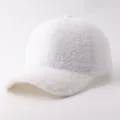 Detail view of white sherpa fleece baseball cap, soft texture and warm design for winter. - Adjustable / White