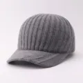Close-up detail of the knitted texture and curved brim on this grey winter baseball cap. - Adjustable / Vertical Stripe Brim Three Stripes - Gray
