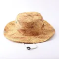 Detailed view of the wide-brim sun hat with straw print texture and adjustable chin strap. - Wide Brim With Rope / Khaki Full Print Fine Grain
