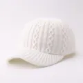 Detailed view of white knit baseball cap, soft cozy winter warm woolen hat, simple daily wear. - Adjustable / Argyle Pattern - White