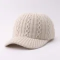 Beige cable knit baseball hat detail showing soft warm woolen texture and classic brim design. - Adjustable / Argyle Pattern - Beige