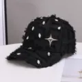 Black distressed baseball cap with sparkling rhinestones and silver star decoration for women. - One Size / Black