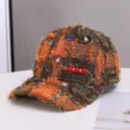 Bruine oranje tweed baseballcap met schitterende strass- en parelversieringen. - Eén maat / Oranje