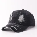 Black distressed denim baseball cap with graffiti paint splatters, trendy autumn sun hat. - Adjustable / Dotted Graffiti Ripped Denim - Black