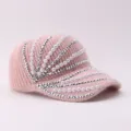 Pink knitted baseball cap detail view showing sparkling rhinestones and elegant faux pearl embellishments. - Adjustable / Empty Top Style / Pink