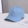 Close-up detail of light blue rhinestone baseball cap, sparkling crystal design elements. - Adjustable / Light Blue